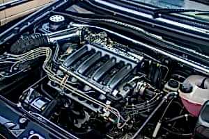 The engine compartment of a car with the hood up