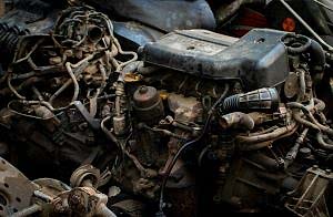 Close-up of a complex car engine with many wires.